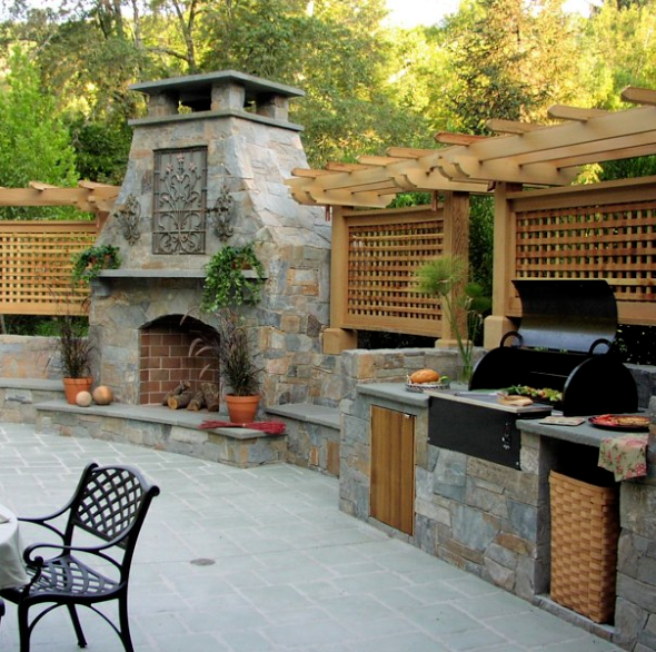 Outdoor kitchen and living area with stone grills station - Central MN Concrete