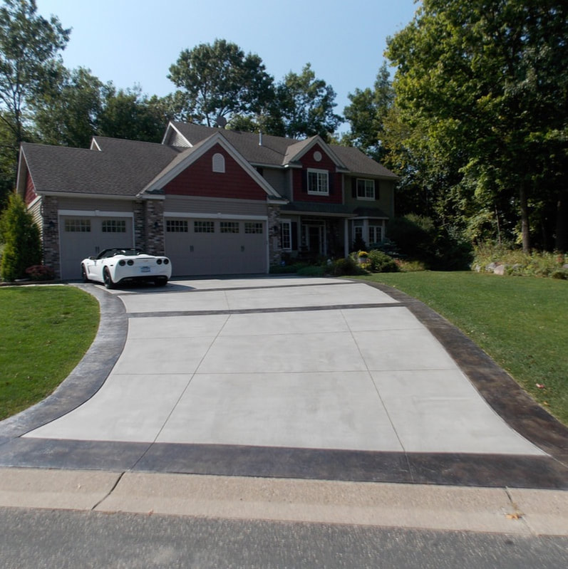 new concrete driveway with a stained concrete border - st. cloud, mn