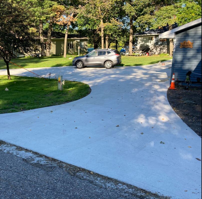 concrete sidewalk and driveway at a richmond minnesota home
